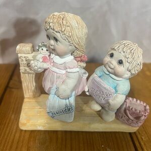 Charming Figurine of Children with Books